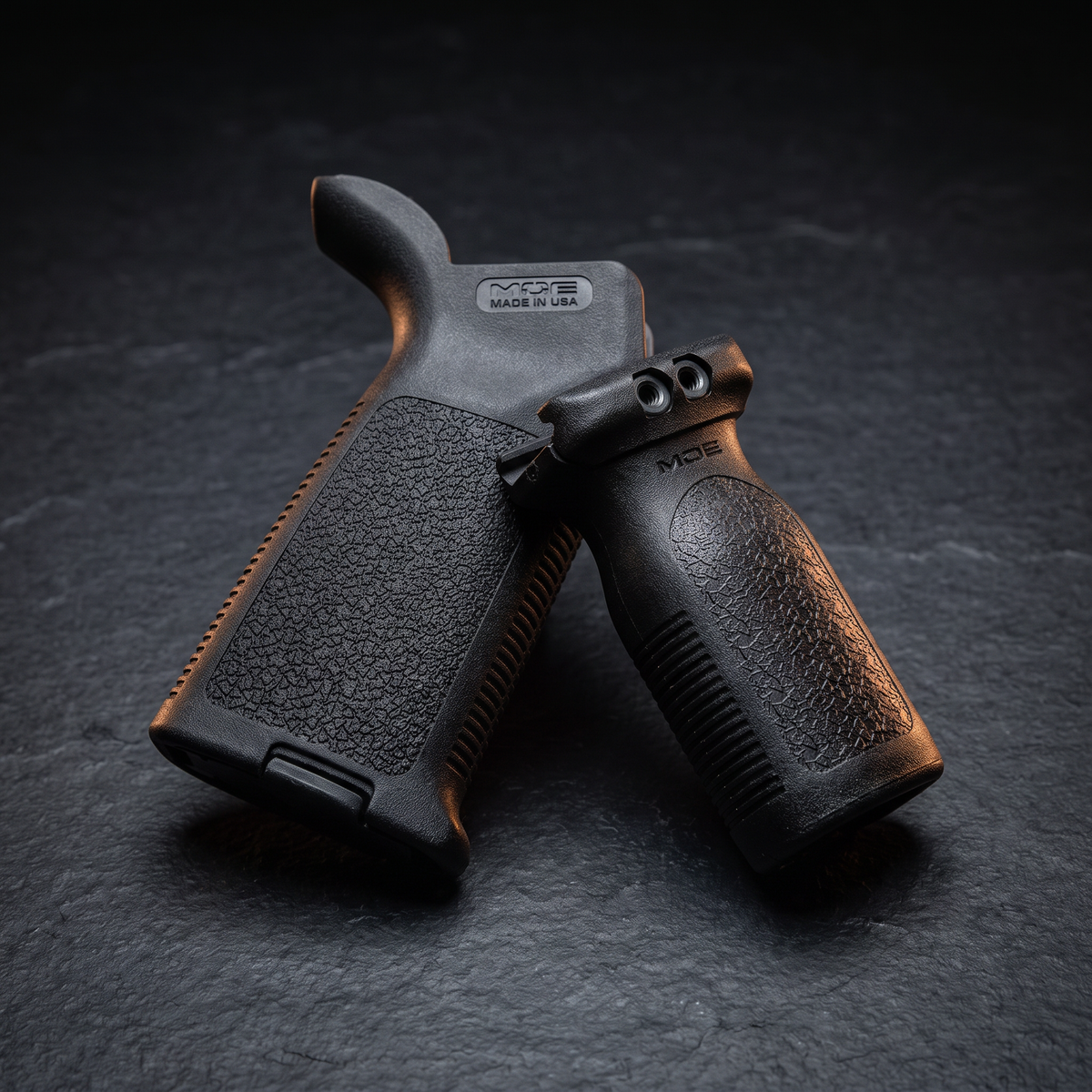 Magpul MOE pistol grip and RVG vertical foregrip on dark slate, accompanying our explainer on AR-15 grip types