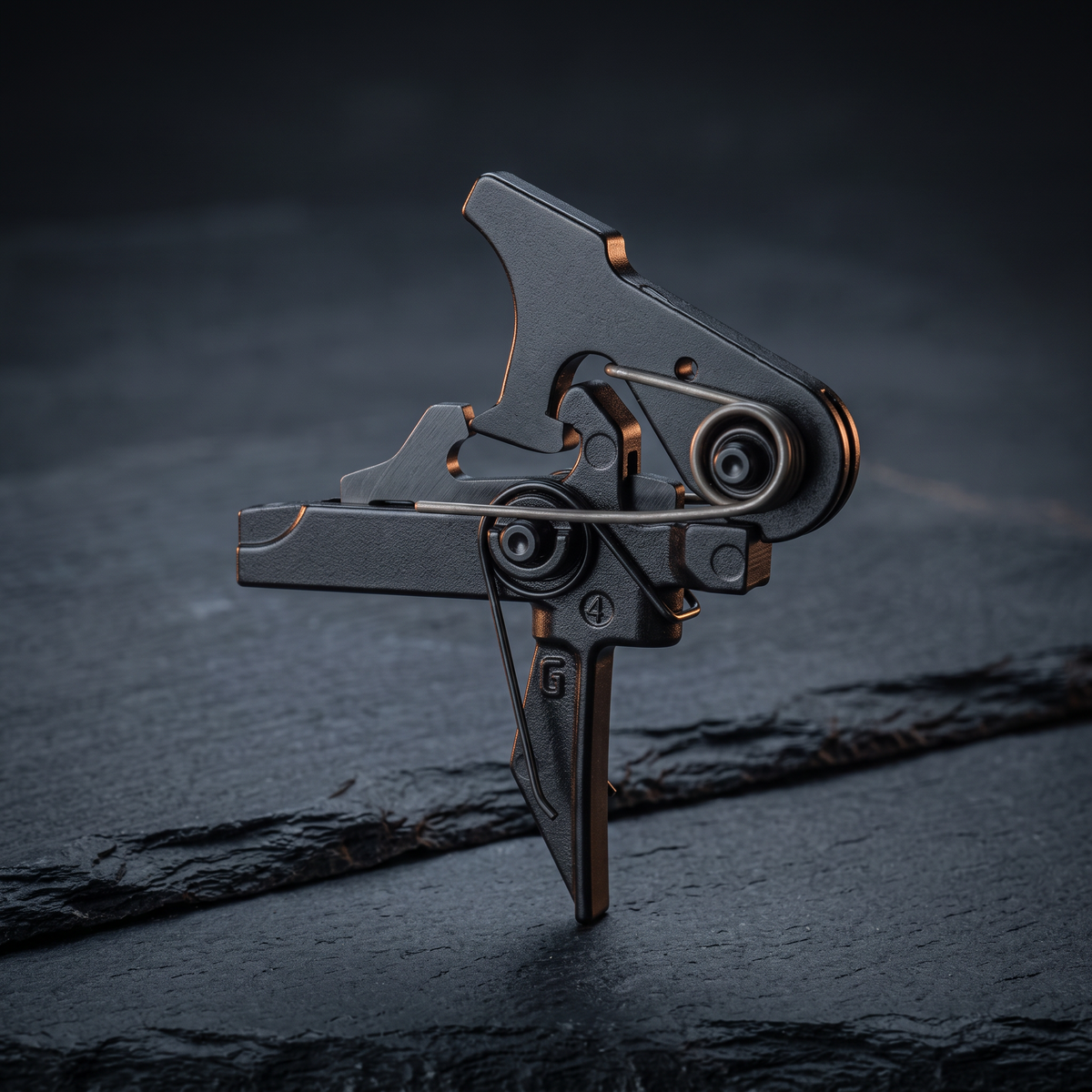 Geissele drop-in AR-15 trigger with a flat shoe on dark slate, illustrating our AR-15 trigger buying guide