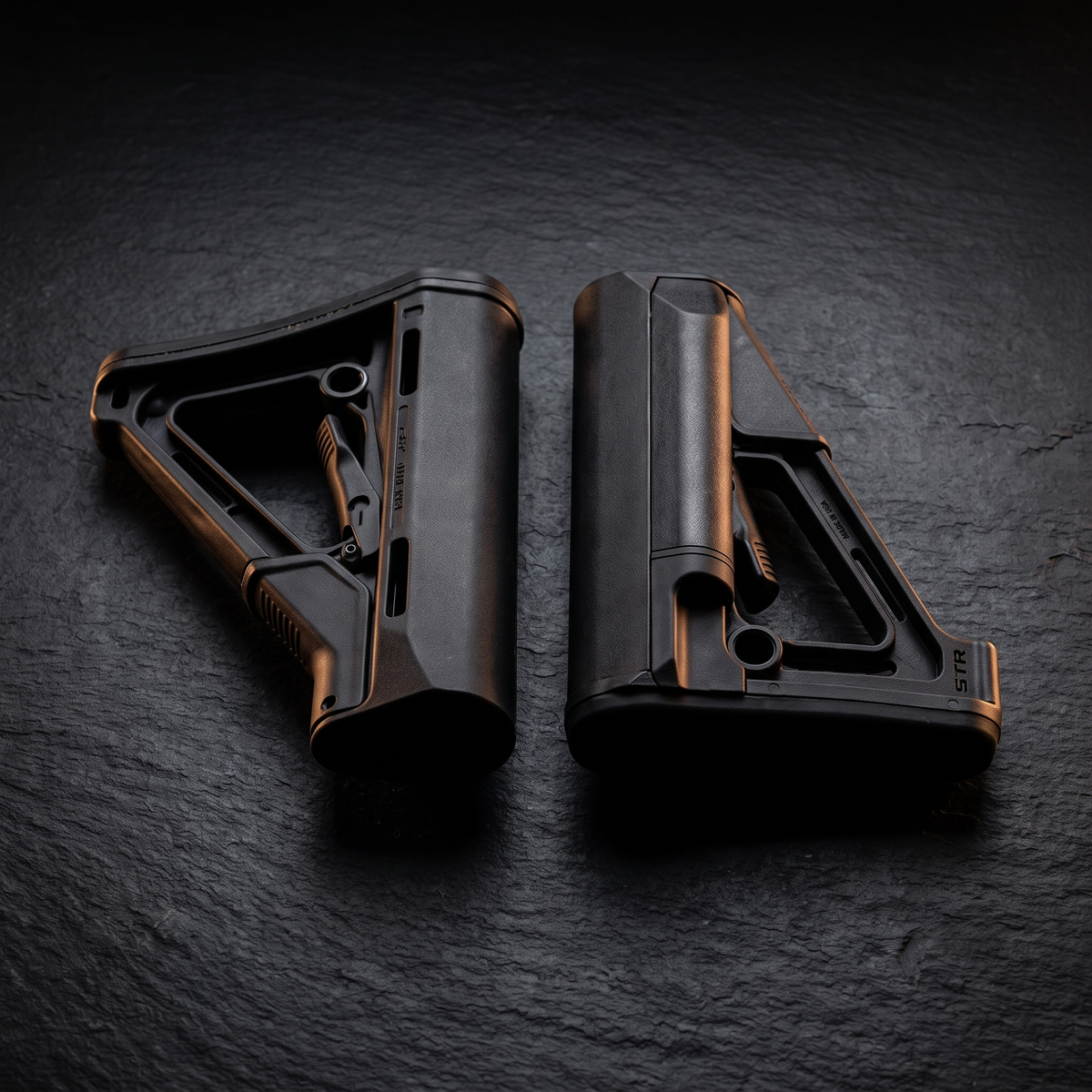 Magpul CTR and STR collapsible AR-15 buttstocks side by side, illustrating our guide to choosing an AR-15 stock
