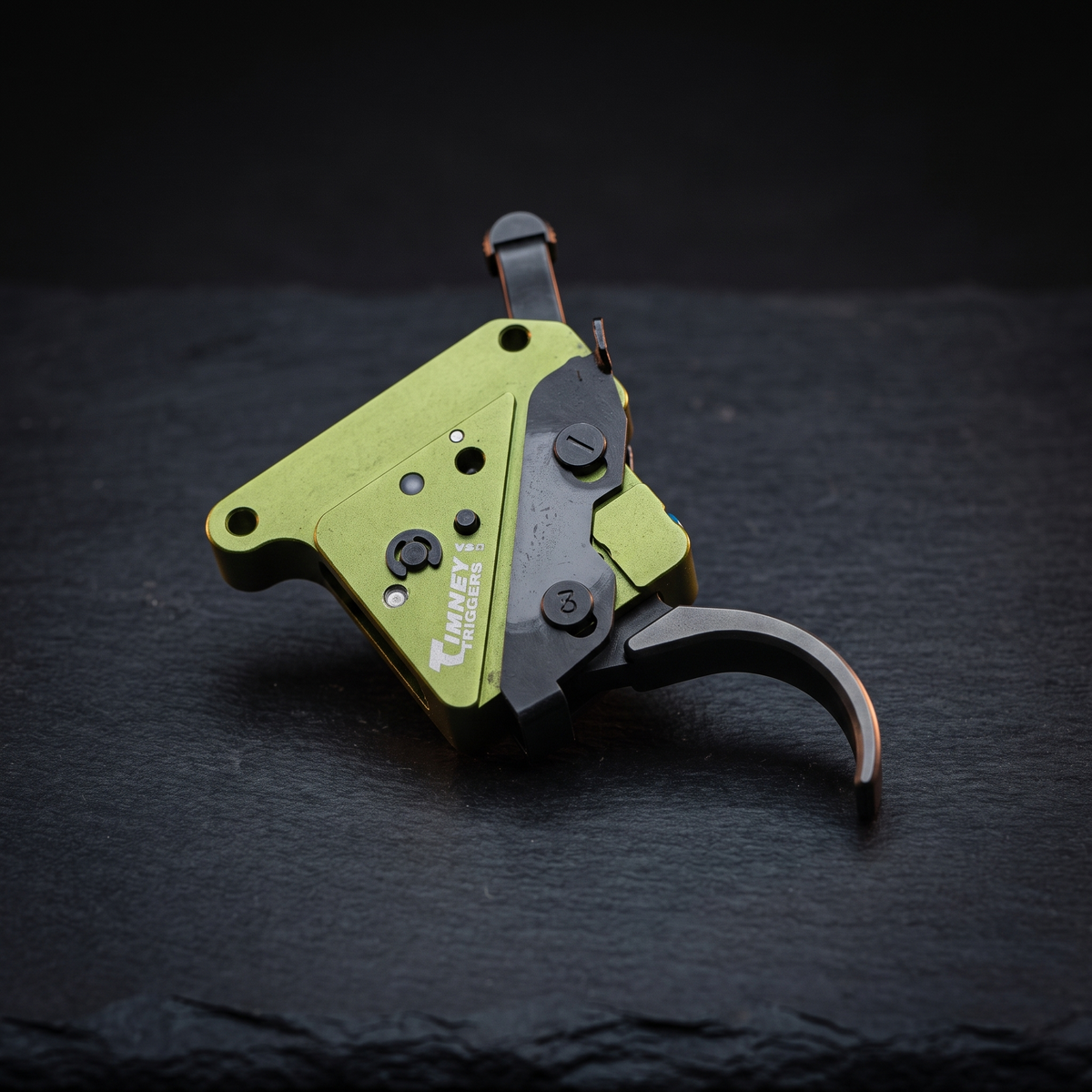 Timney Elite Hunter replacement trigger for the Remington 700 on dark slate, illustrating our Remington 700 trigger upgrade guide