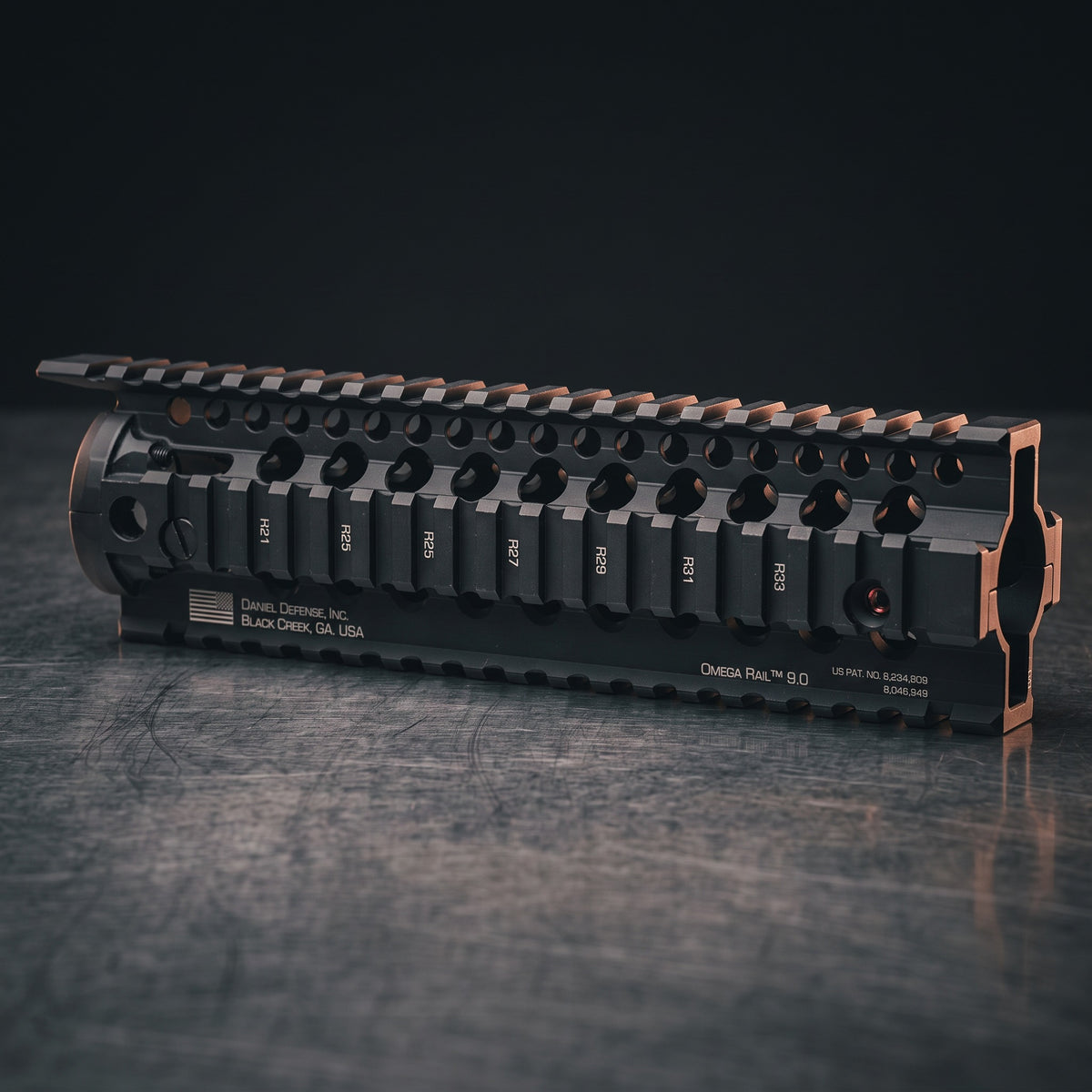 AR-15 Handguards – Daniel Defense Omega Rail 9.0 free-float handguard on a dark steel surface