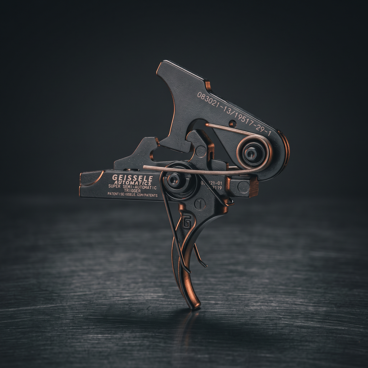 Rifle Triggers – Geissele SSA two-stage AR-15 trigger on a dark steel surface
