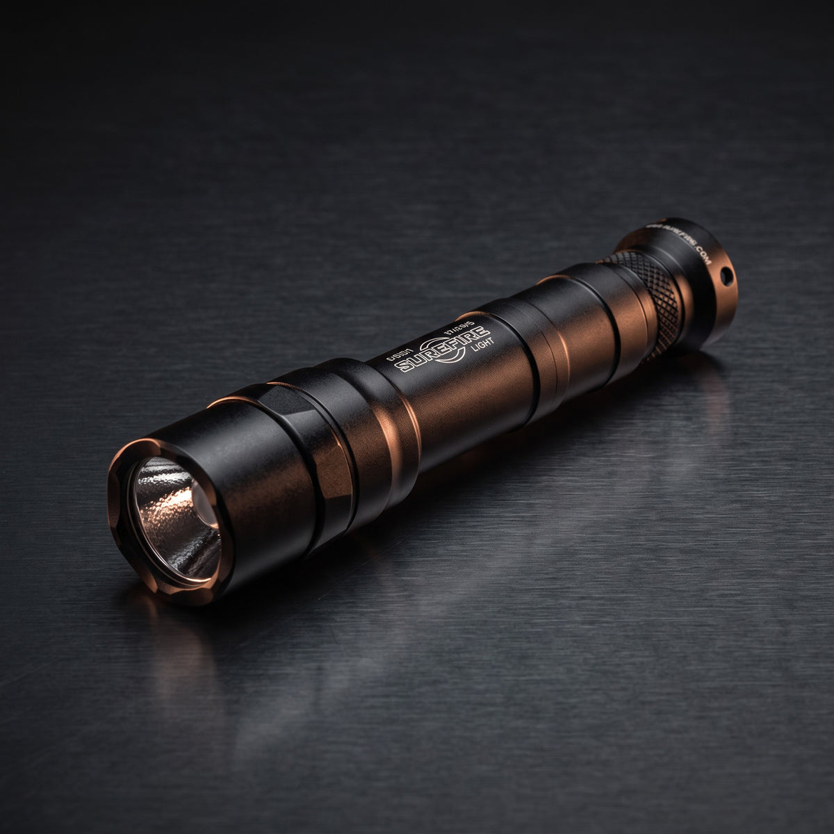 Weapon Lights – SureFire M640DF Scout Light Pro weapon light on a dark steel surface