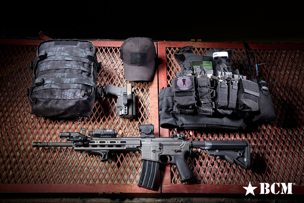 BCM KAG Kinesthetic Angled Grip for Picatinny, with a rifle and kit laid out on a table