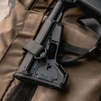 Magpul ACS-L Carbine Stock Mil-Spec for AR-15/M4, on a rifle resting on a kit bag