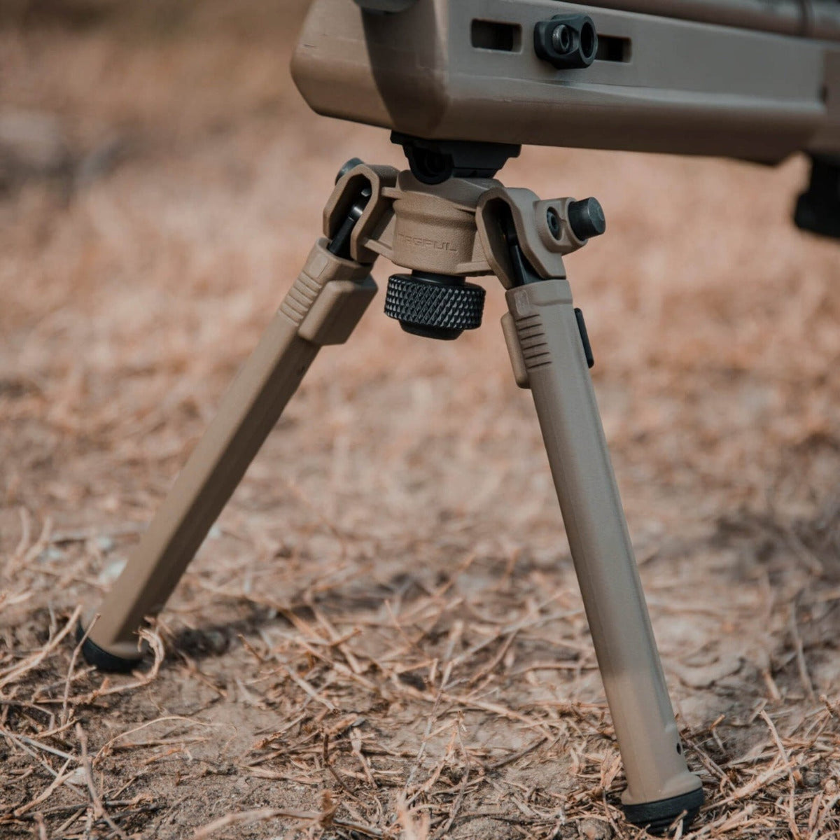 Magpul Bipod for M-LOK, deployed on a rifle in the field