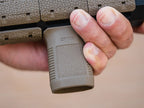 Magpul M-LOK SVG Short Vertical Grip, in the hand on an FDE M-LOK handguard