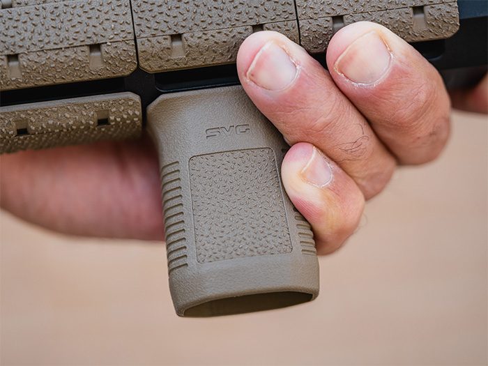 Magpul M-LOK SVG Short Vertical Grip, in the hand on an FDE M-LOK handguard