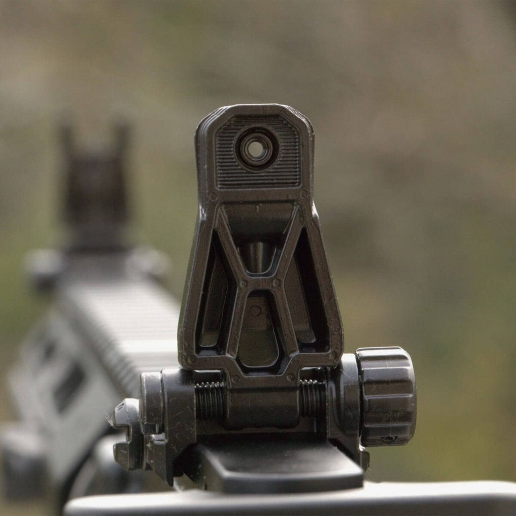 Magpul MBUS Pro Rear Folding Sight, deployed on a rifle, rear view outdoors