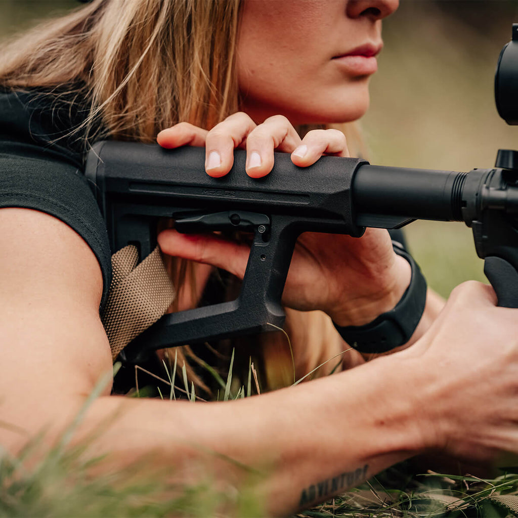 Magpul MOE PR Carbine Stock Mil-Spec in use by a prone shooter adjusting the stock