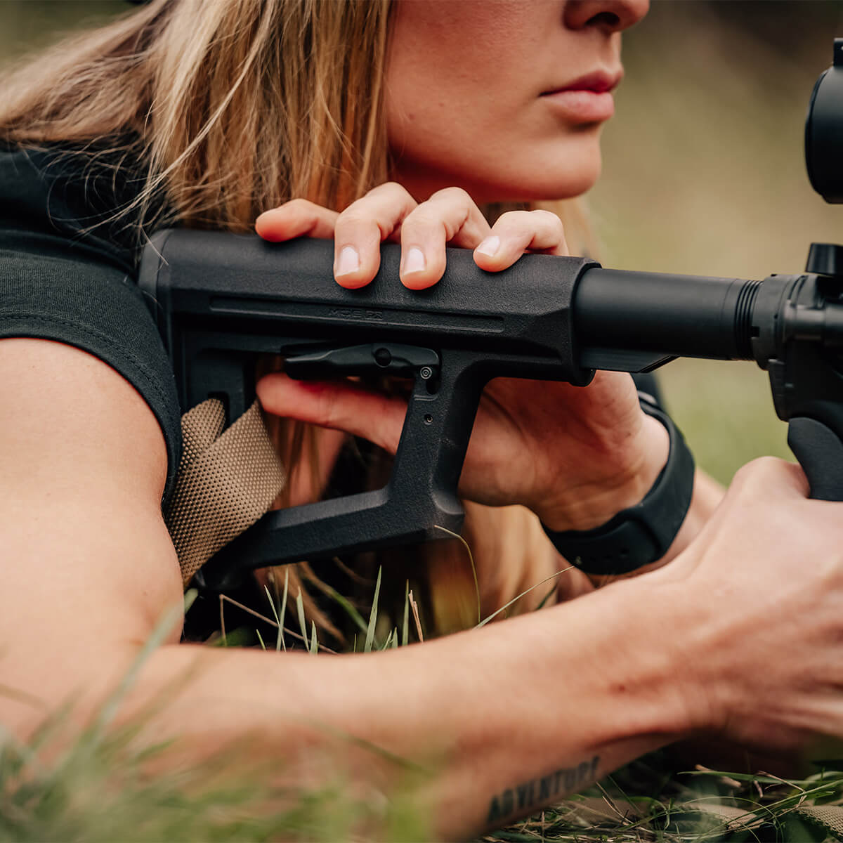 Magpul MOE PR Carbine Stock Mil-Spec in use by a prone shooter adjusting the stock