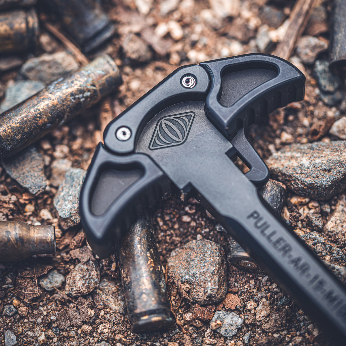 Reptilia PULLER charging handle for AR-15, lifestyle shot on spent brass cases