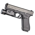 Streamlight TLR-1 HP weapon light with the two CR123A lithium cells that power it