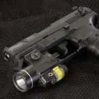 Streamlight TLR-4 G weapon light with green laser fitted beneath a handgun barrel