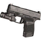 Streamlight TLR-7 X sub pistol light seen from above, showing the ambidextrous rear paddles